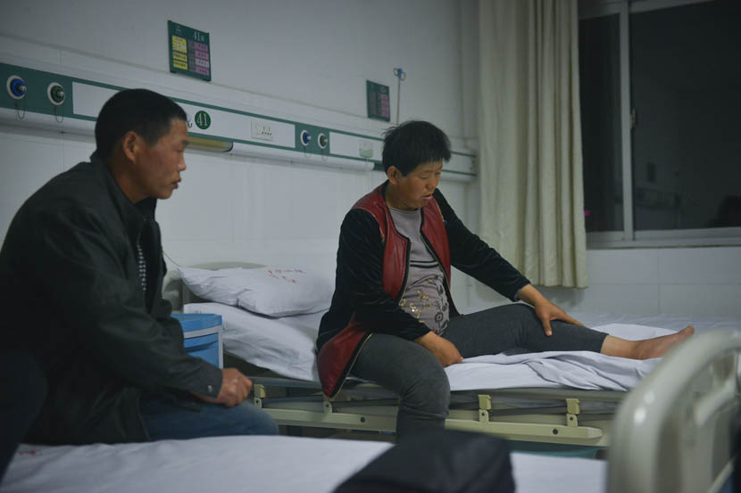 Liu Guilan, 10 months pregnant, sits in a hospital bed in Jining, Shandong province, May 11, 2015. She is scheduled for a cesarean section the next day. Sky/VCG